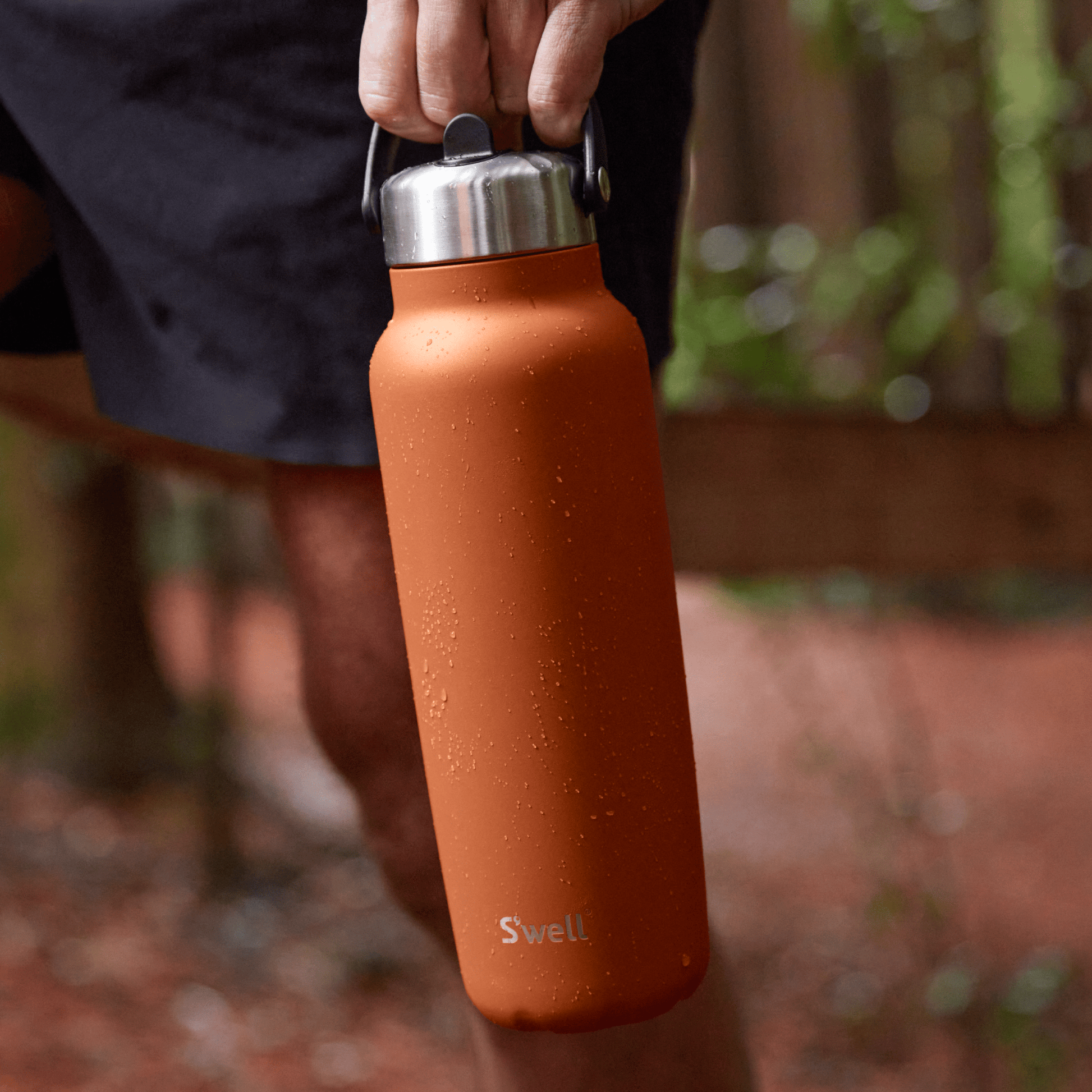 explorer-with-flip-straw-lid-40oz-z7 Swell-Explorer-Water-Bottle-40oz-Orange-Carnelian-LifeStyle.png